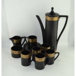 A PORTMEIRION POTTERY COFFEE SET, black with gilt Greek key design, comprising; coffee pot, milk