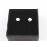 A PAIR OF CULTURED PEARL STUD EARRINGS, mounted on 9ct gold