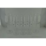 A SET OF SIX DARTINGTON GLASS CHAMPAGNE FLUTES, and a pair of Dartington red wine glasses