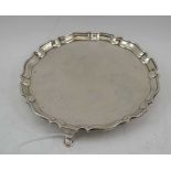 HAWKSWORTH, EYRE & CO. LTD AN EDWARDIAN SILVER WAITER of Georgian design, with piecrust rim,