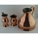 A 19TH CENTURY "HALF GALLON" COPPER MEASURE, together with two copper tankards (3)