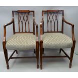 A PAIR OF EDWARDIAN MAHOGANY FRAMED OPEN ARMCHAIRS, lattice backs, on squared tapering spade foot