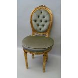 A FRENCH GILT FRAMED SINGLE CHAIR, the back with ribbon crest and bound reed edge, on turned, fluted