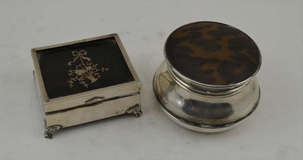 TWO EARLY 20TH CENTURY SILVER & TORTOISESHELL TABLE BOXES, the round one with plain removable lid,