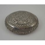 AN EASTERN WHITE METAL SNUFF BOX, oval form with domed cover, floral decorated, 8cm x 6.5cm, weight;