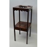 AN EARLY 19TH CENTURY MAHOGANY WASHSTAND, the top with cut out for a bowl, and with two recessed