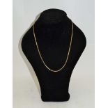 A 9CT GOLD NECKLACE of decorative block link design, 58cm long, 15g