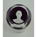 A BACCARAT FACET GLASS PAPERWEIGHT, purple base inset sulphide portrait of HRH Prince Charles,