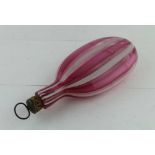 A 19TH CENTURY GLASS FLASK, pink and opaque white stripes on a clear ground, fitted cork stopper,