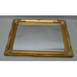 A DECORATIVE GILT FRAMED BEVEL PLATE WALL MIRROR, plate size; 42cm x 65cm