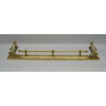 A VICTORIAN DESIGN BRASS FIRE KERB, fitted with fire tool rests on scrolls, internal dimensions;