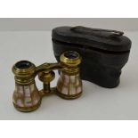 A VICTORIAN PAIR OF OPERA GLASSES, panelled in mother of pearl, in original leather case