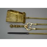 A SET OF THREE GEORGIAN DESIGN BRASS FIRE TOOLS, comprising tongs, shovel and poker