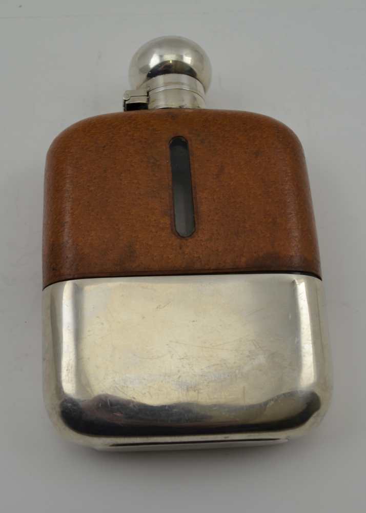 JAMES DIXON & SONS A SILVER MOUNTED SPIRIT FLASK, with leather cover, having bayonet twist cap and