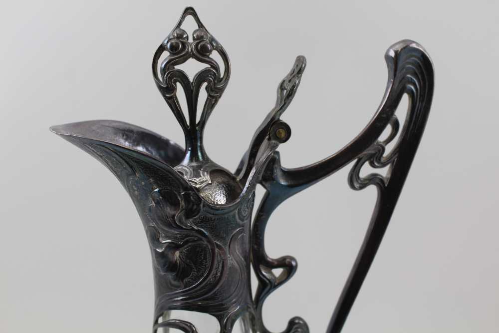 AN ART NOUVEAU DESIGN CLARET JUG, having cast metal decorative mounts in the WMF jugendstil form, - Image 4 of 5