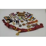 A QUANTITY OF ASSORTED MEDALS & MEDAL RIBBONS, to include military and society orders, the order