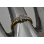 A LADY'S DIAMOND SET GOLD RING, angular Art Deco setting of seventeen diamonds, ring size; "P"