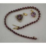 A TENNIS LINK BRACELET inset rubies (unmarked) 19cm long, together with A GOLD PENDANT, amethyst