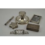 A COLLECTION OF SILVER ITEMS comprising; a silver menu holder, a small silver photo frame, a capstan