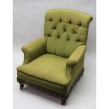A VICTORIAN DEEP SEATED EASY CHAIR, turned and fluted fore supports on ceramic castors, green fabric