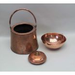 AN EARLY 20TH CENTURY COPPER BUCKET, a beaten mixing bowl and a 19th century copper foot warmer (3)