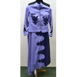 A GIRL'S SIDE SADDLE RIDING HABIT suitable for costume classes, comprising; lilac jacket with dark