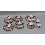 A PART STAFFORDSHIRE TEA SET, Old Imari design, comprising; eight cups, ten plates, one bread