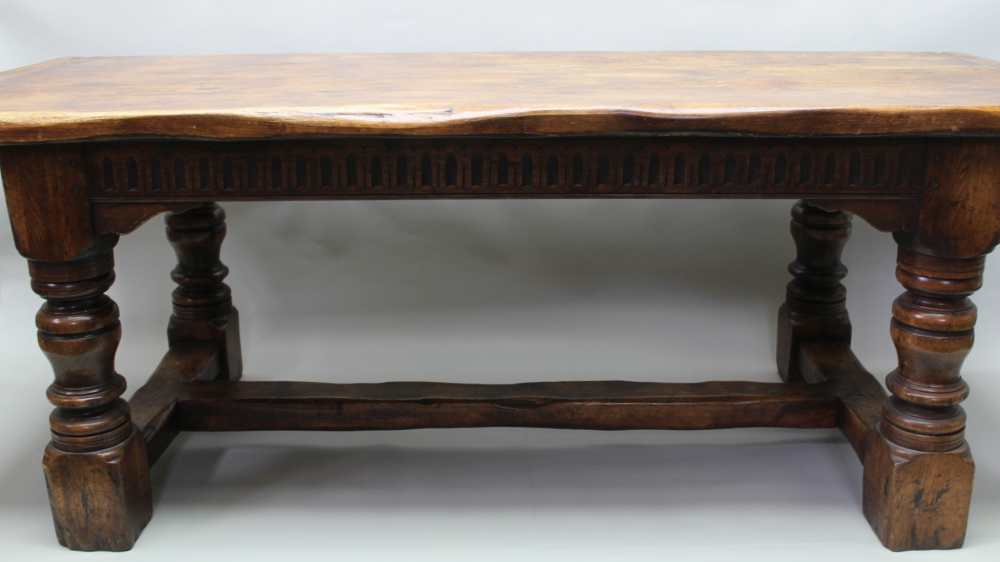 A 17TH CENTURY DESIGN OAK REFECTORY TABLE, having plank top on ring turned supports, with lunette - Image 5 of 5