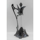 AN ART NOUVEAU DESIGN CLARET JUG, having cast metal decorative mounts in the WMF jugendstil form,