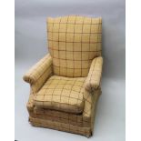 AN UPHOLSTERED EASY CHAIR, with loose cushion seat upholstered in Rupert tartan fabric, red check on