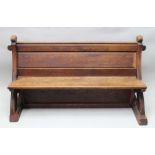 A VICTORIAN PINE PEW, shaped ends, panel seats & back, 164cm wide