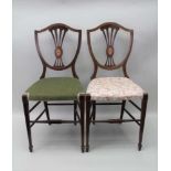 A PAIR OF EDWARDIAN BEDROOM CHAIRS, shield backs with inlaid patera and upholstered seats