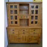 A CONTEMPORARY BLONDE OAK DRESSER, fitted two glazed doors to back flanking central open shelves and