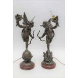 A PAIR OF EARLY 20TH CENTURY FRENCH BRONZE EFFECT SPELTER TABLE LAMPS, of cherub design, both with