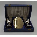 SALLOWAYS LTD A CASED PAIR OF SILVER GOBLETS AND SILVER COASTERS, "The Lichfield Goblets",