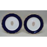 TWO CAULDON TRINITY COLLEGE CAMBRIDGE PLATES, decorated in cobalt blue and gilded, 23cm in diameter