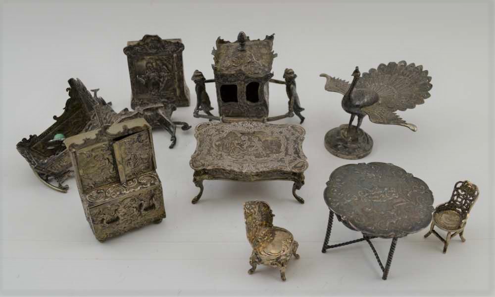 A COLLECTION OF DUTCH WHITE METAL MINIATURES, to include; furniture, Sedan chair, peacock, the