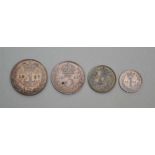 A SET OF FOUR SILVER MAUNDY COINS, 1887