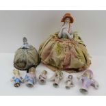 A COLLECTION OF EARLY 20TH CENTURY CERAMIC HALF-DOLLS, two mounted to fabric crinoline skirts, the