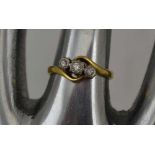 AN 18CT GOLD LADY'S THREE STONE DIAMOND RING, ring size; "H"