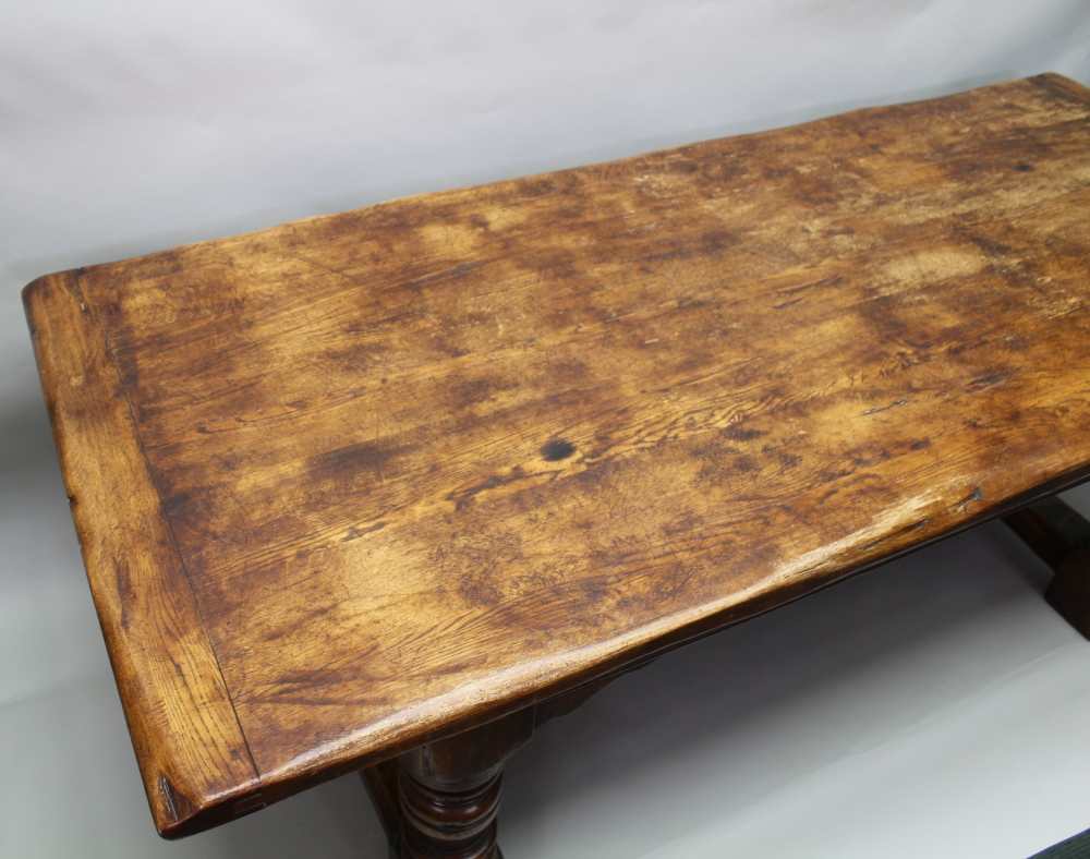 A 17TH CENTURY DESIGN OAK REFECTORY TABLE, having plank top on ring turned supports, with lunette - Image 2 of 5