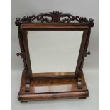 AN ORNATE 19TH CENTURY MAHOGANY DRESSING TABLE TOP MIRROR, with carved and pierced crest rail,