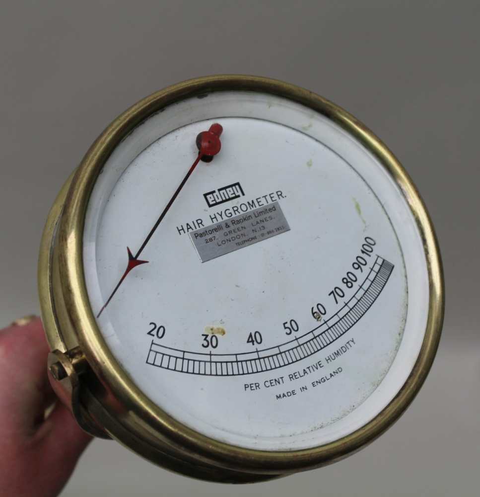 A BRASS 'EDNEY HAIR HYGROMETER' calibrated dial, 12cm diameter