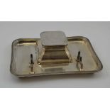 HUKIN & HEATH LTD A SILVER INKSTAND with pen rack, the hinged lid opening to reveal a clear glass
