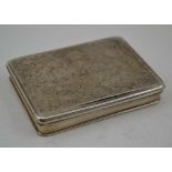 AN 18TH CENTURY WHITE METAL SNUFF BOX, having decoratively engraved hinged cover and gilded