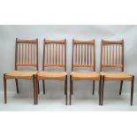 A SET OF EIGHT DANISH DESIGN TEAK SPINDLE BACK CHAIRS with strung seats, 98cm high