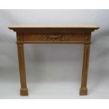 AN ADAM DESIGN PINE FIRE SURROUND, with urn, scrolls and graduated bell husk decoration, mantel