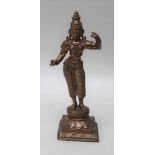 A BRASS MODEL OF DEVI, Great Mother of Hindu myth, on plinth base, 18cm high and a hide bound