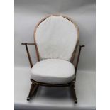 AN ERCOL ROCKING CHAIR, with upholstered seat & back cushions