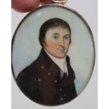 A MINIATURE PORTRAIT PAINTING of an unknown gentleman, c.1800, plaited hair to the reverse with